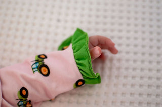 One - Piece Ruffle Buttflap Pajamas - Tractors On Pink - Sugar Bee Clothing
